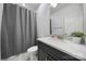 Neutral bathroom with a shower and granite countertop vanity with a decorative soap dispenser at 2148 Nims Village Dr, Fort Mill, SC 29715