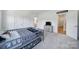 Clean, neutral bedroom features a bunk bed, storage cube dresser, and carpeted floors at 2148 Nims Village Dr, Fort Mill, SC 29715