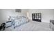 Spacious bedroom with a trundle bed, sleek black bookshelf, and light-filled ambiance at 2148 Nims Village Dr, Fort Mill, SC 29715
