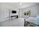 Bright bedroom with a TV, a study desk, large window and cozy bed at 2148 Nims Village Dr, Fort Mill, SC 29715
