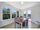 Bright breakfast nook features natural light and sliding glass doors to the exterior deck at 2148 Nims Village Dr, Fort Mill, SC 29715