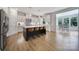 A stylish kitchen featuring a large island with seating and modern appliances and light wood floors at 2148 Nims Village Dr, Fort Mill, SC 29715