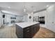 Open concept kitchen featuring a large island with a white countertop and stainless steel appliances at 2148 Nims Village Dr, Fort Mill, SC 29715