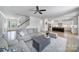 Open-concept living space showing a staircase, living room and kitchen with stainless steel appliances at 2148 Nims Village Dr, Fort Mill, SC 29715