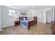 Spacious main bedroom featuring hardwood floors and three windows at 2148 Nims Village Dr, Fort Mill, SC 29715