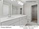 Primary bathroom featuring a double bowl vanity with modern hardware and a walk-in shower at 217 Lake George Dr, Shelby, NC 28152