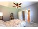 Comfortable bedroom featuring a ceiling fan, neutral paint, and access to ensuite bathroom at 219 Harrowfield Hts, York, SC 29745