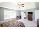 Bright main bedroom featuring a ceiling fan, neutral paint, and an ensuite bathroom at 219 Harrowfield Hts, York, SC 29745