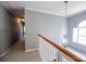 Bright hallway with modern lighting fixture, carpet, and staircase at 219 Harrowfield Hts, York, SC 29745