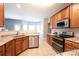 Modern kitchen features granite countertops and stainless steel appliances at 219 Harrowfield Hts, York, SC 29745