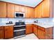 Stylish kitchen with stainless steel appliances and light wood cabinets at 219 Harrowfield Hts, York, SC 29745