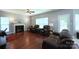 Cozy living room with hardwood floors, fireplace, and comfortable leather seating at 219 Harrowfield Hts, York, SC 29745