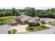 Aerial view of a beautiful property featuring a pond, pool, and lush greenery at 2484 Early Richmond Ct, Denver, NC 28037