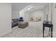 Spacious bonus room with plush carpeting, a sofa, and a desk area, perfect for relaxation or work at 2484 Early Richmond Ct, Denver, NC 28037