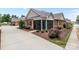 Attractive brick home featuring a screened porch and meticulously maintained landscaping at 2484 Early Richmond Ct, Denver, NC 28037