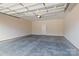 Clean and spacious two-car garage featuring a concrete floor and ample room for vehicles and storage at 2484 Early Richmond Ct, Denver, NC 28037