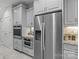 Modern kitchen with stainless steel refrigerator and built-in appliances offers convenience and style at 2484 Early Richmond Ct, Denver, NC 28037