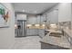 Modern kitchen with stainless steel appliances, granite countertops, and ample cabinet space at 2484 Early Richmond Ct, Denver, NC 28037