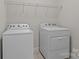 Functional laundry room featuring a Whirlpool washer and dryer set at 2484 Early Richmond Ct, Denver, NC 28037