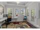 Bright office featuring multiple windows and a comfortable workspace, ideal for working from home at 2484 Early Richmond Ct, Denver, NC 28037