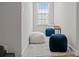 Cozy upstairs hallway nook with fluffy and colorful seating, great for relaxation and reading at 2484 Early Richmond Ct, Denver, NC 28037