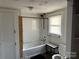 Bathroom featuring a shower/tub combo, toilet, and a small window at 30497 Orchard Ln, Albemarle, NC 28001