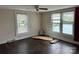 Bedroom with hardwood flooring and multiple windows at 30497 Orchard Ln, Albemarle, NC 28001