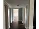 Hallway with doors leading to various rooms in the home at 30497 Orchard Ln, Albemarle, NC 28001