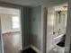 Hallway near the bathroom, featuring the bathtub at 30497 Orchard Ln, Albemarle, NC 28001