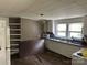 This kitchen features white cabinets, a double sink, and an electric range at 30497 Orchard Ln, Albemarle, NC 28001