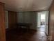 A spacious living room with wooden floors and natural light at 30497 Orchard Ln, Albemarle, NC 28001