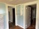 Living room with hardwood floors and built-in shelving at 30497 Orchard Ln, Albemarle, NC 28001
