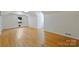 Spacious room with hardwood floors, dormer windows, and neutral walls providing a versatile living space at 3165 Pendleton Ave, Charlotte, NC 28210
