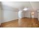 Spacious and bright bonus room with hardwood floors, ample space, and a clean, minimalist aesthetic at 3165 Pendleton Ave, Charlotte, NC 28210