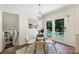 Cozy dining area with a view of the pool and backyard through sliding glass doors at 3165 Pendleton Ave, Charlotte, NC 28210