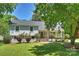 Charming two-story home with brick accents and a well-manicured front yard at 3165 Pendleton Ave, Charlotte, NC 28210