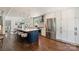 Modern kitchen features stainless steel appliances, a large island, white cabinetry, and hardwood floors at 3165 Pendleton Ave, Charlotte, NC 28210