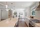 Bright kitchen with island and stainless steel appliances adjoins dining area with modern decor at 3165 Pendleton Ave, Charlotte, NC 28210
