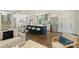 Modern kitchen boasts an island with seating, stainless steel appliances, and bright white cabinets at 3165 Pendleton Ave, Charlotte, NC 28210