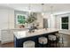 Kitchen boasts a large island, modern decor, and plenty of counter space for cooking at 3165 Pendleton Ave, Charlotte, NC 28210