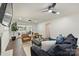 Inviting living room with stylish seating, ceiling fans, fireplace, and sliding glass doors to a covered outdoor area at 3165 Pendleton Ave, Charlotte, NC 28210