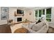 Inviting living room with a marble fireplace, a plush rug, and ample seating, creating a warm and welcoming atmosphere for gatherings at 3165 Pendleton Ave, Charlotte, NC 28210