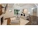 Bright and spacious living room with a fireplace, a cozy seating area, hardwood floors, and stylish built-ins, perfect for relaxation at 3165 Pendleton Ave, Charlotte, NC 28210