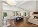 Open concept living space with a modern kitchen, large island with seating, hardwood floors, and a cozy fireplace, great for entertaining at 3165 Pendleton Ave, Charlotte, NC 28210