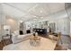 Open concept living area with hardwood floors, a modern kitchen island, a cozy seating area, and a bright and airy ambiance at 3165 Pendleton Ave, Charlotte, NC 28210