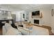 Spacious living area showcasing a modern kitchen, a cozy fireplace, stylish decor, and an open layout ideal for entertaining at 3165 Pendleton Ave, Charlotte, NC 28210