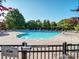 Inviting community pool area with multiple lounge chairs and shade at 3511 Dominion Green Dr, Charlotte, NC 28269
