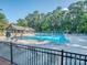 Large outdoor community pool with lap lanes, lounge chairs, and a covered seating area at 3511 Dominion Green Dr, Charlotte, NC 28269