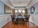 Elegant dining room featuring a large table, decorative lighting, and hardwood floors at 3511 Dominion Green Dr, Charlotte, NC 28269
