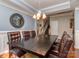 Dining area with a large table, chandelier lighting, and access to the staircase at 3511 Dominion Green Dr, Charlotte, NC 28269
